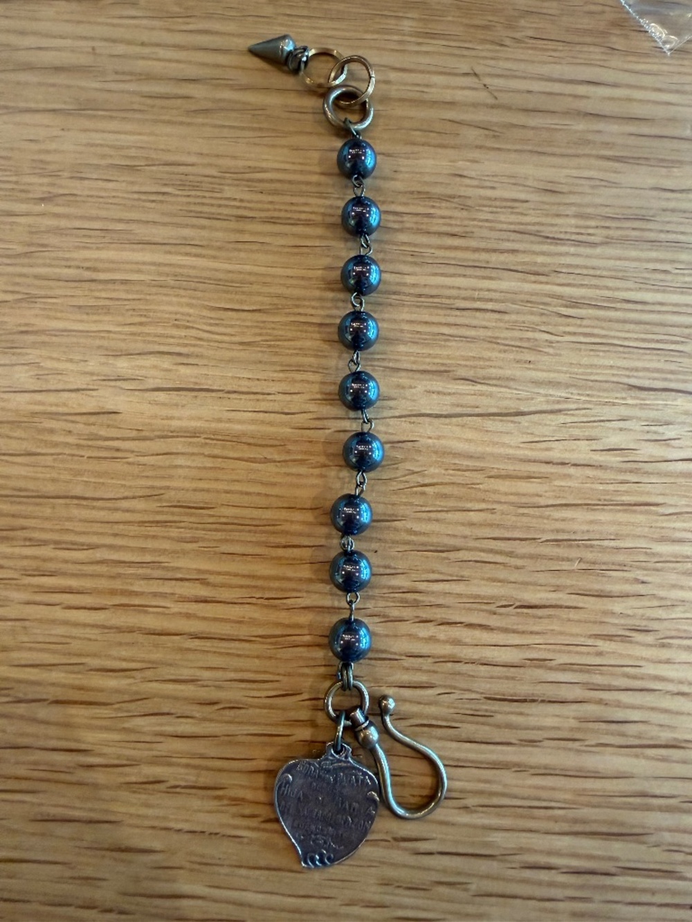 Bracelet with glass beads, and charm